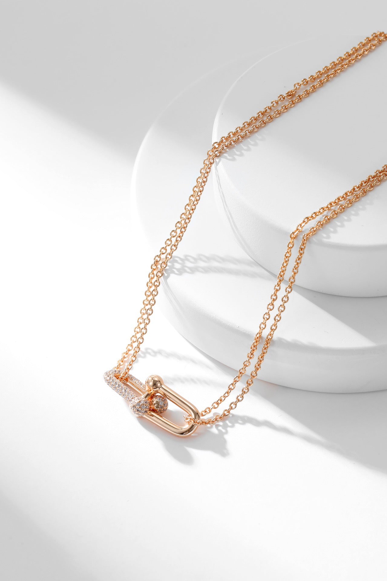 Icy Elegance: Zircon-Embellished Buckle Pendant Necklaces in Silver and Rose Gold Plating