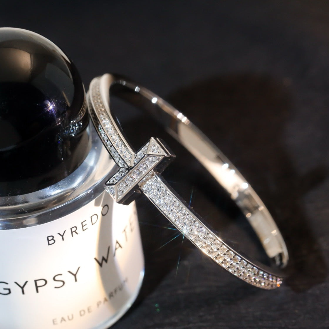 Cross of Light: Zircon-Encrusted Silver Bangle