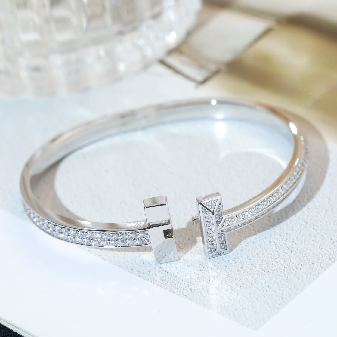 Cross of Light: Zircon-Encrusted Silver Bangle